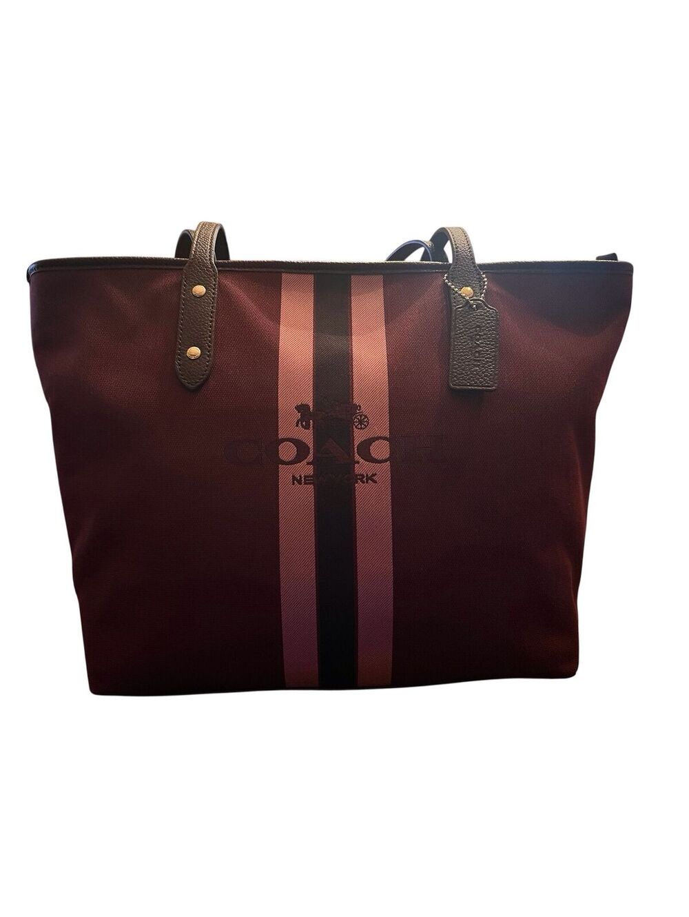 C1. Coach Horse and Carriage Jacquard City Tote in an oxblood color